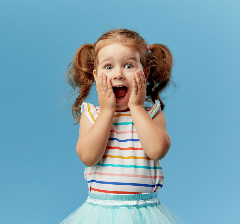 Young girl mocks looking scared, she is having dental emergency, afraid of dentist.